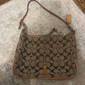 This is a vintage Coach (2004) crossbody bag in tan and brown leather/canvas.